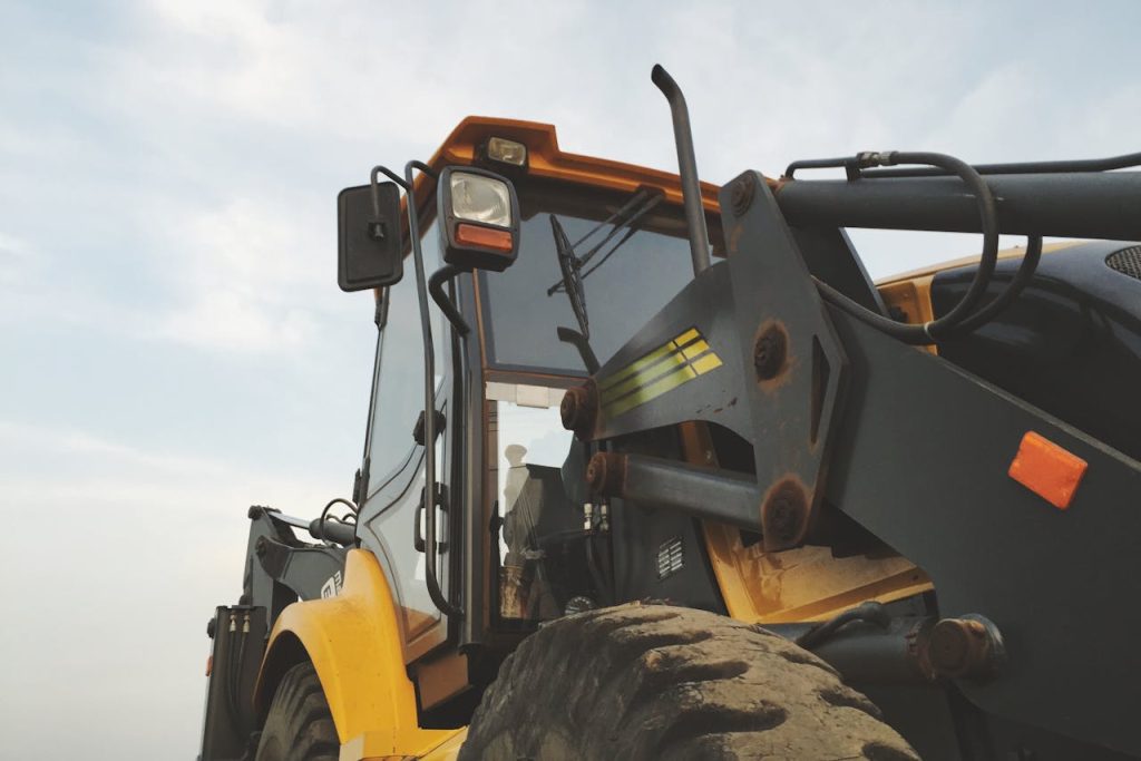 Yellow and Black Heavy Equipment Under Blue Sky